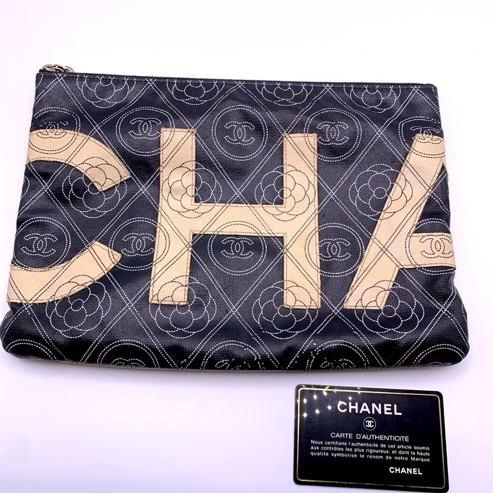 Chanel Black/White Coated Canvas CC Camellia Large O-Pouch Bag - Chic & Unique